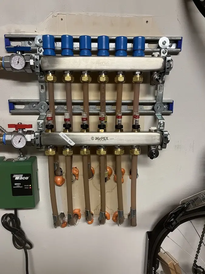 Plumber performing Water Heater Repair at a residential property in Eaton